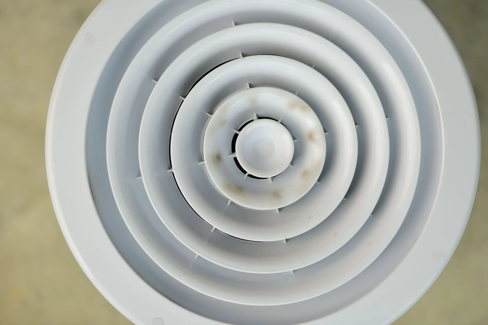Round white ceiling diffuser vent used in ducted air conditioning systems