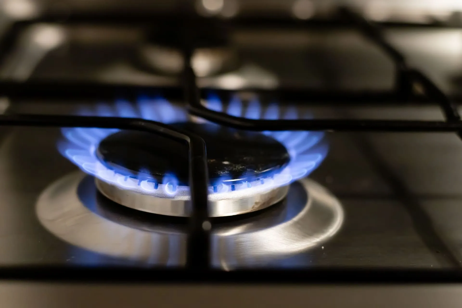 Blue gas stove flame, a reminder to act if you smell gas in house