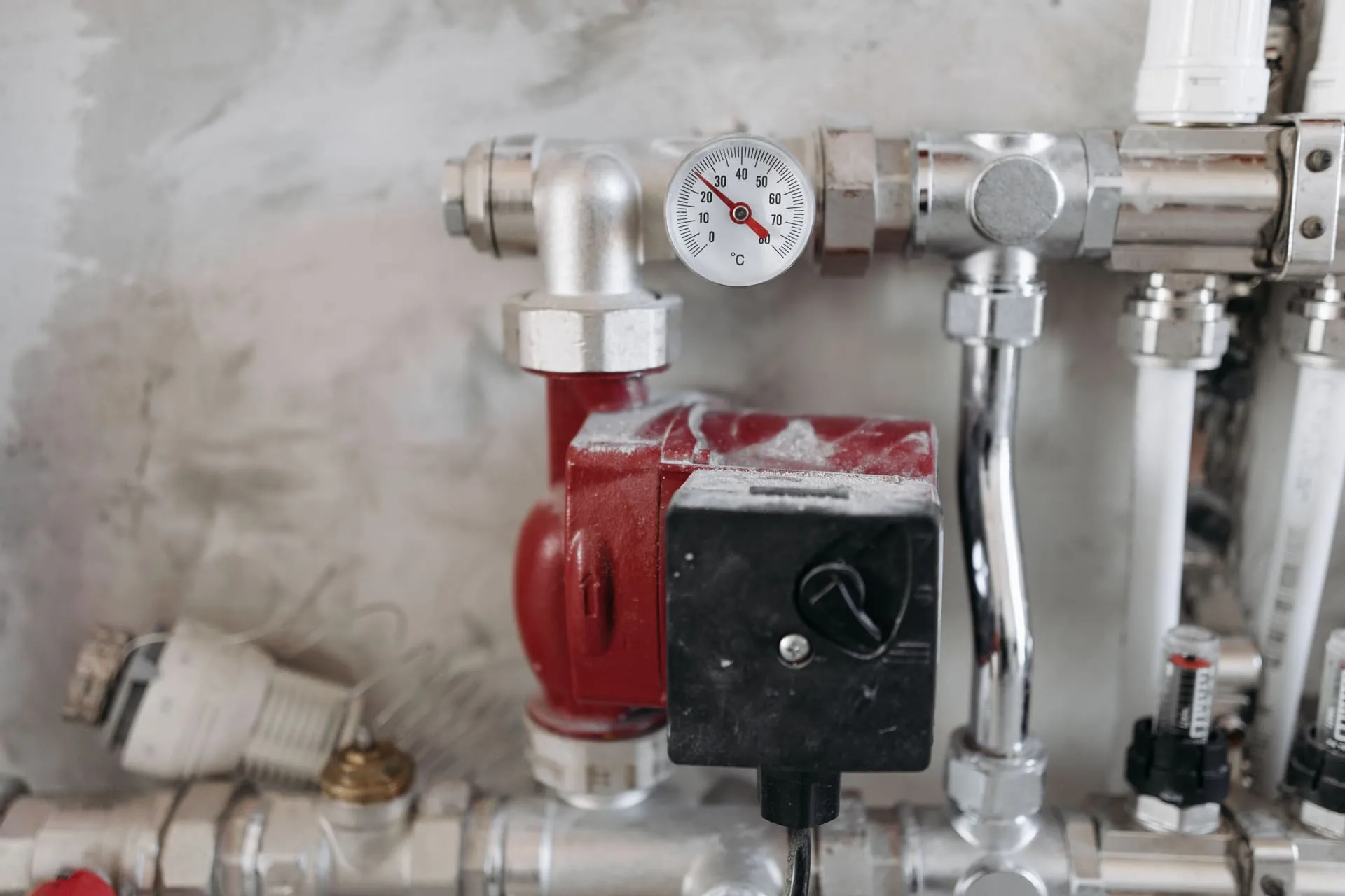 Hot water pipework, valves and temperature gauge where pressure relief valve hot water issues arise