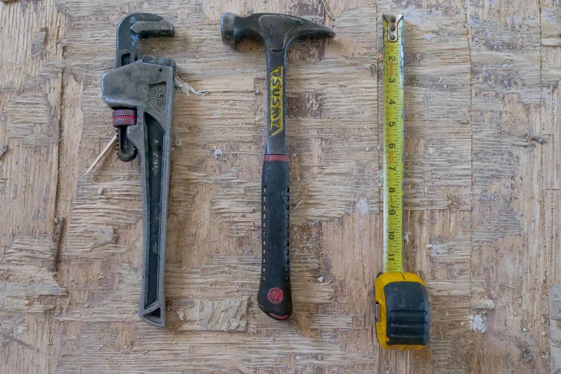 Pipe wrench, hammer and tape measure, the tools behind a plumber call out fee